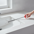 DrainGrab clog remover claw over a clean sink