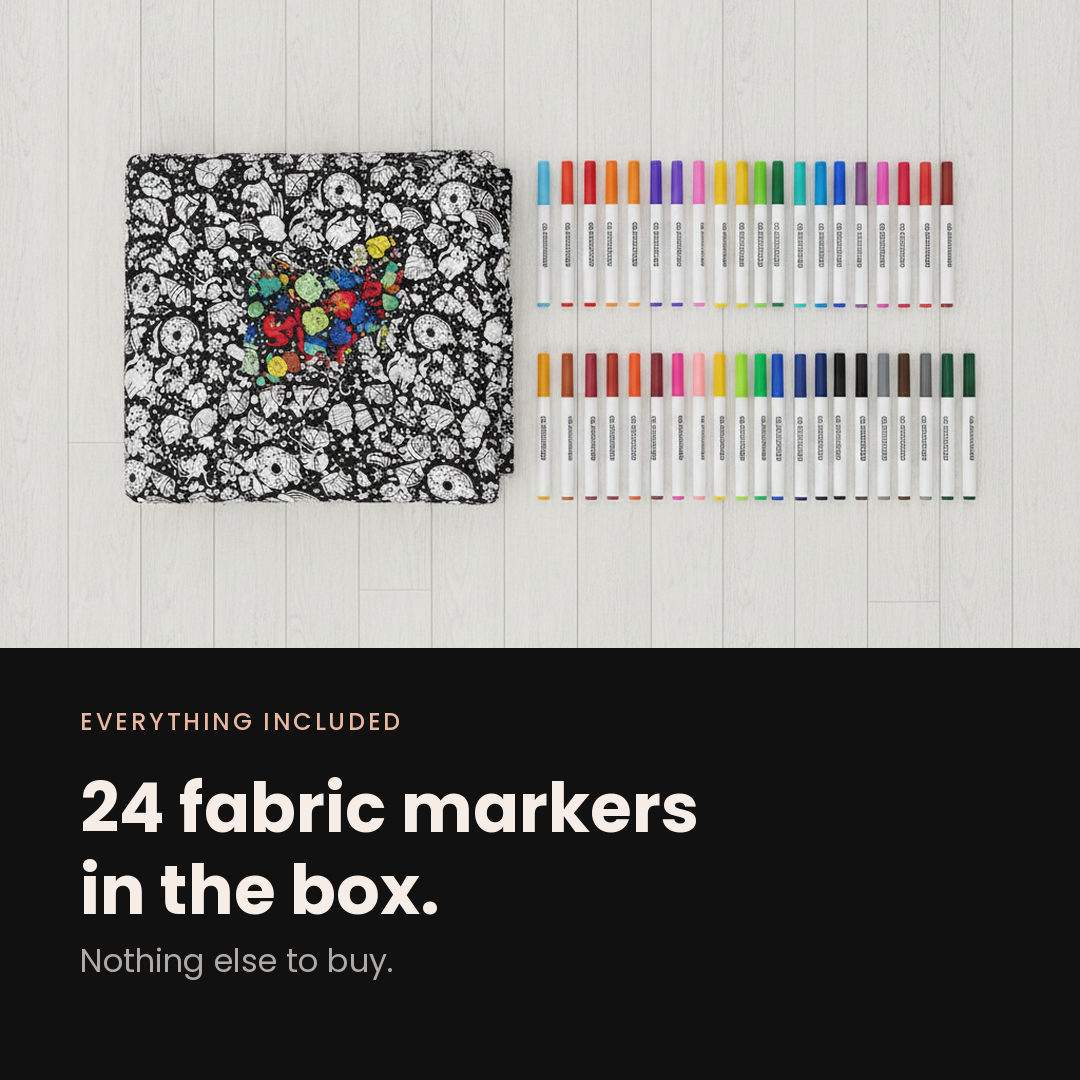 Everything included: the folded blanket next to the 24 fabric markers that come in the box