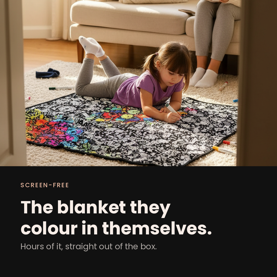 Screen-free: the blanket they colour in themselves — a child colouring the blanket on the living-room rug